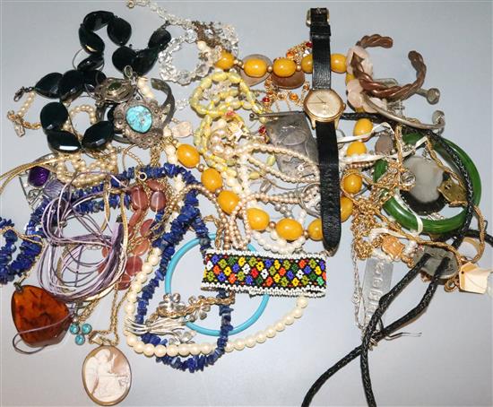 A quantity of mainly costume jewellery including some silver, an enamelled pendant and a large amber bead.